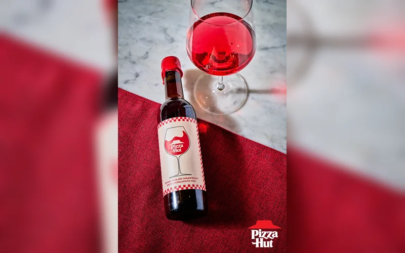 Unwrap the Holidays with Pizza Huts Exclusive Tomato Wine and Triple Treat Box