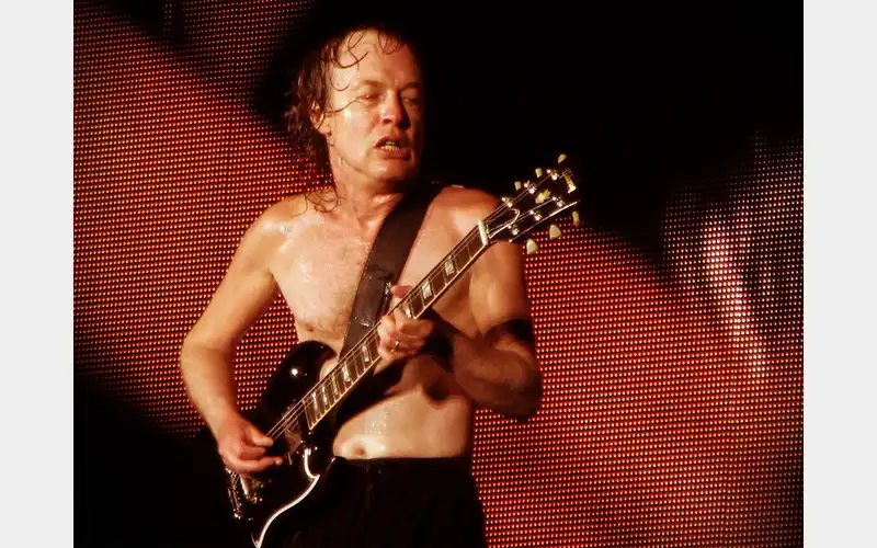 Angus Young Celebrates Malcolm Young’s Rhythm Guitar Legacy in AC/DC